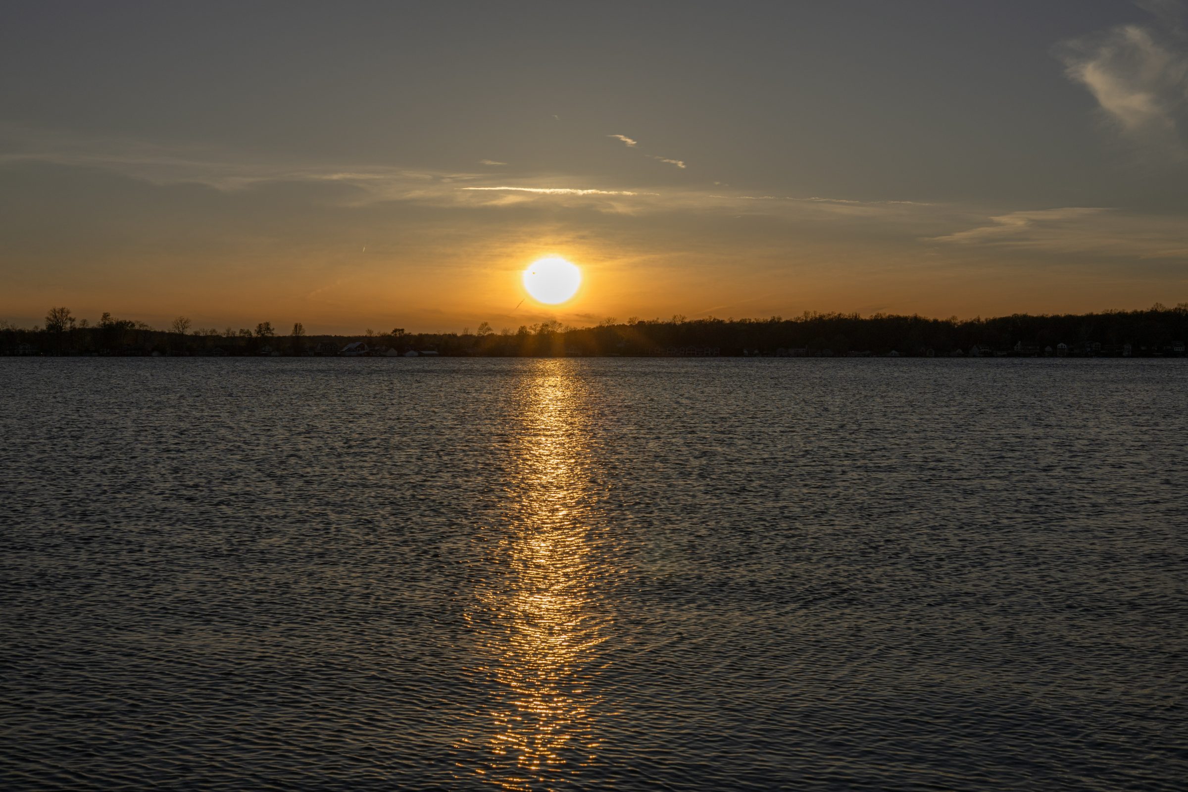 Sunset over the Lakes Region, homes along the far shore